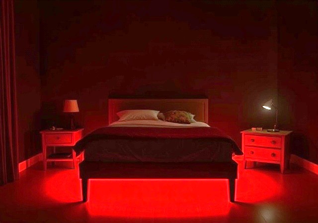 bed with red glow underneath