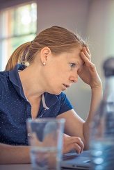 woman stressed at computer
